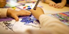 Photo of a childs hand drawing